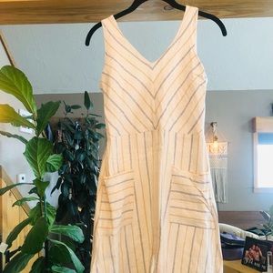 Women’s cream colored dress with pinstripes.